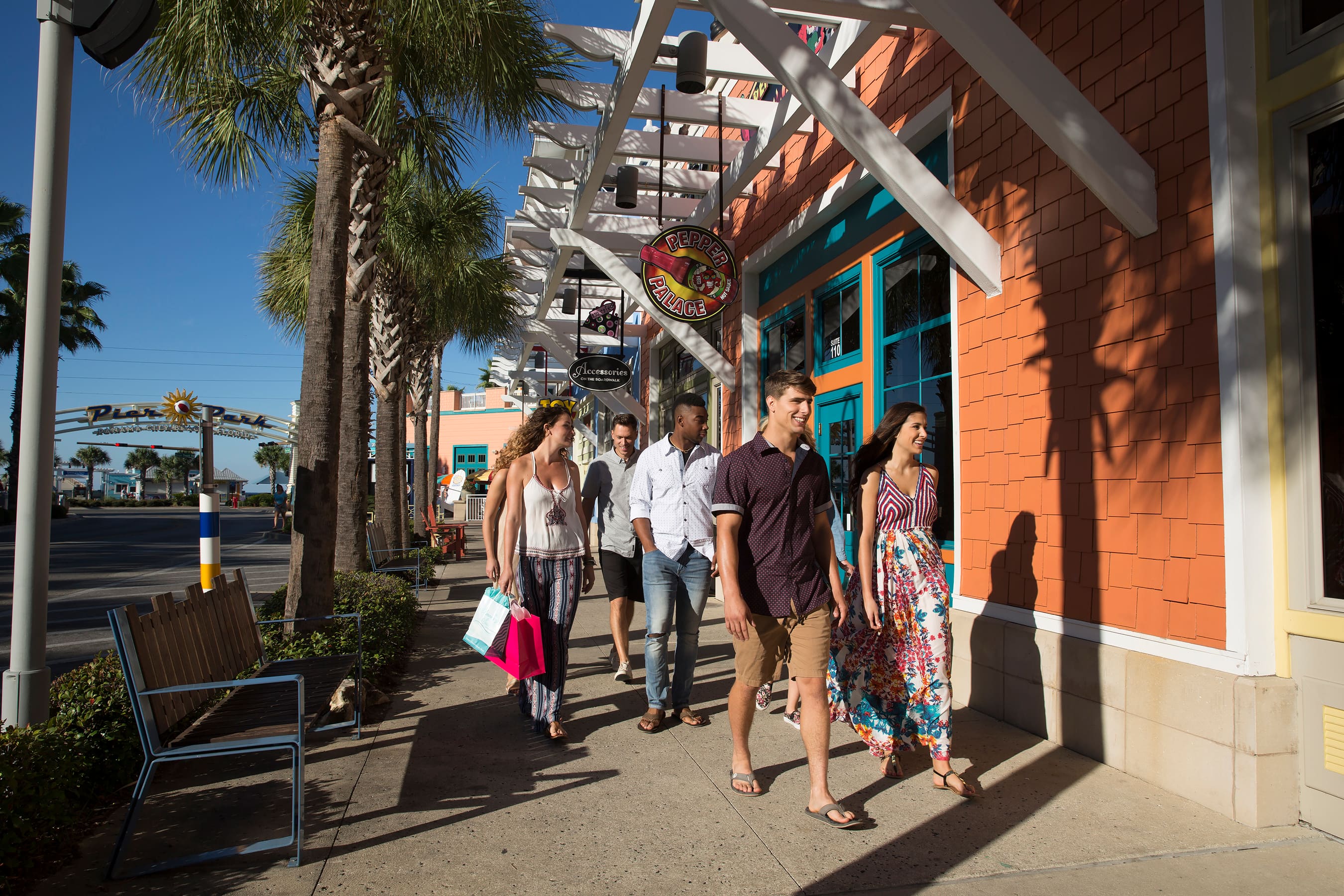 People walking among shops at Pier Park in Panama City Beach