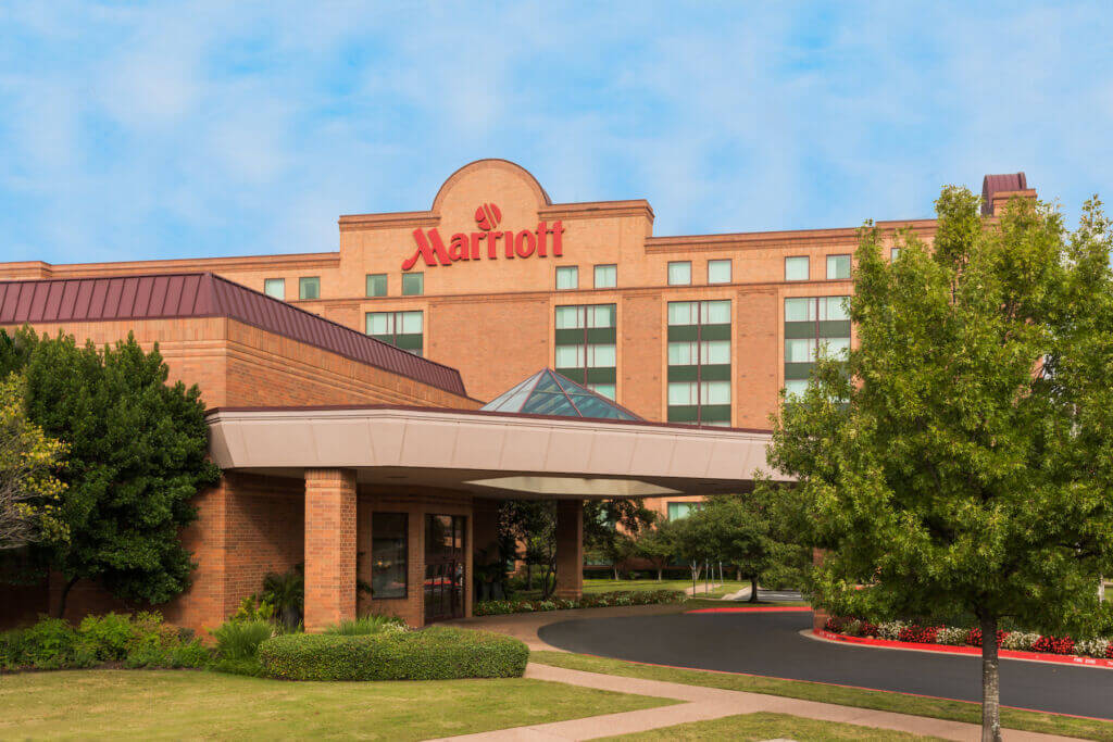 Exterior_photo_of_the_Austin_Marriott_North_254987542 A brown hotel building with the word Marriott at the top of the building with trees around the exterior of the building