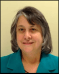 Marsha is wearing a teal colored blazer