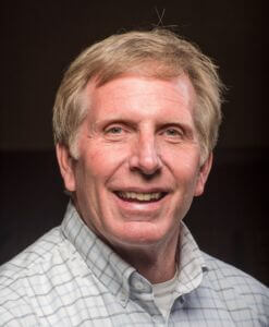William Botten Headshot Bill is wearing light colored plaid shirt and has light hair and eyes