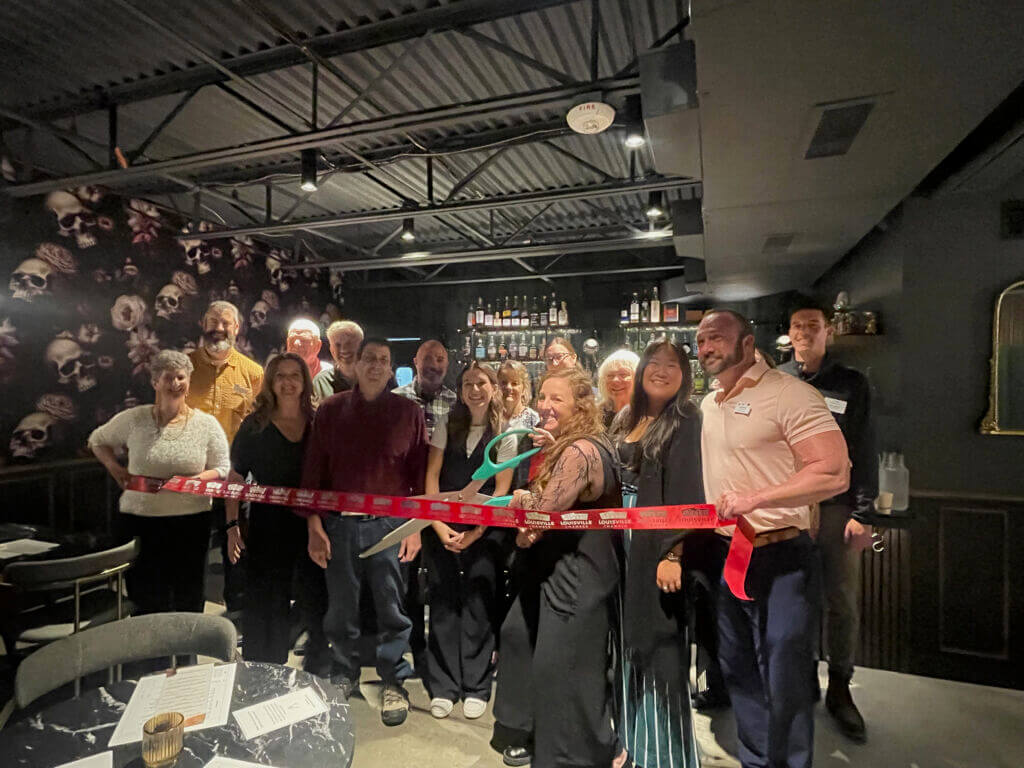 Noras 24 ribbon cutting