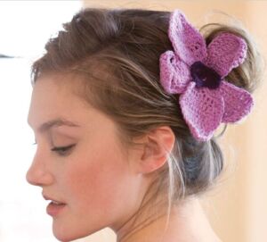 crochet orchid pin in woman's hair