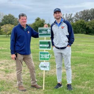 2 people with a sign