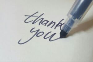 Image of pen writing thank you