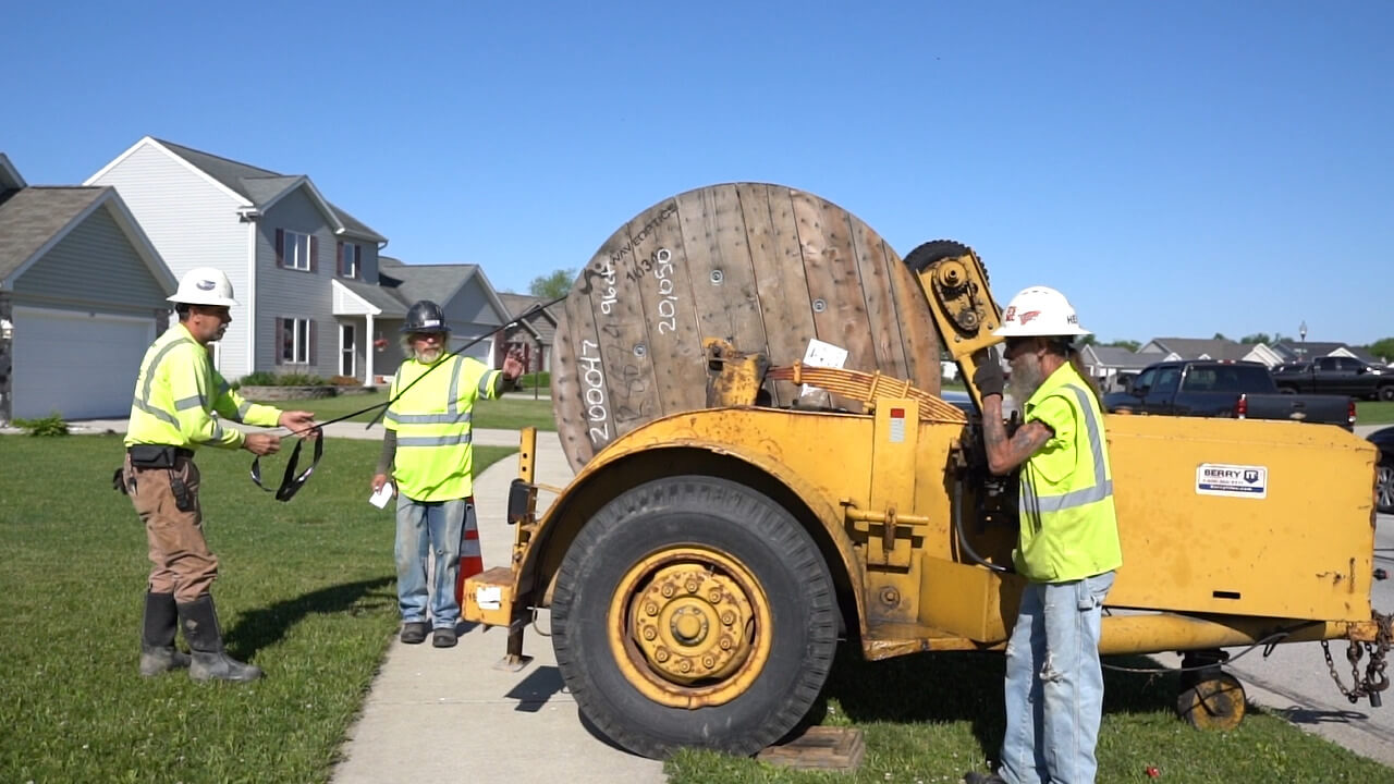 Surf Internet construction crews install fiber-optic cable in a residential neighborhood, part of the network expansion that has now reached more than 200,000 serviceable addresses across the Great Lakes region.