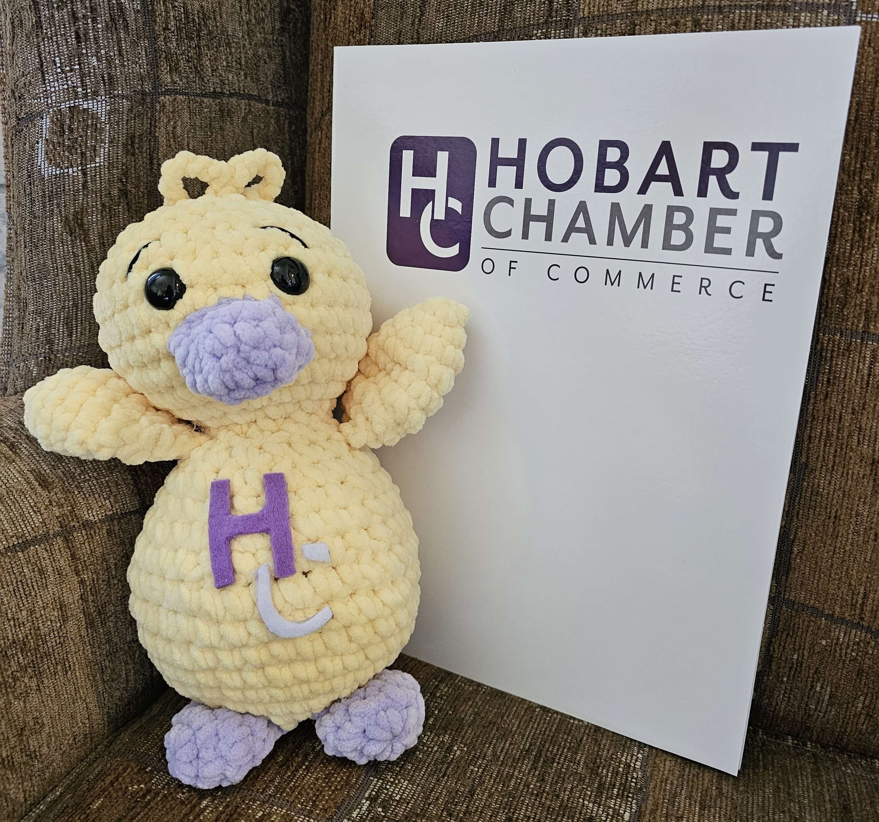 crochet duck next to hobart chamber sign