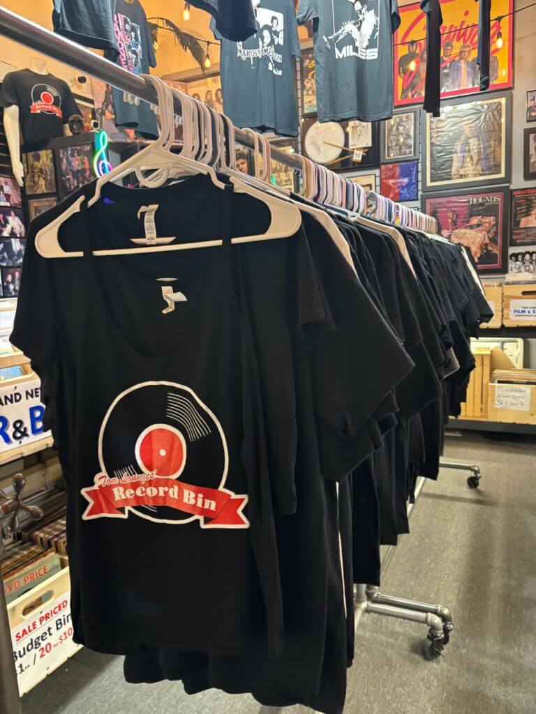 One of the shirt racks at the Record Bin. 