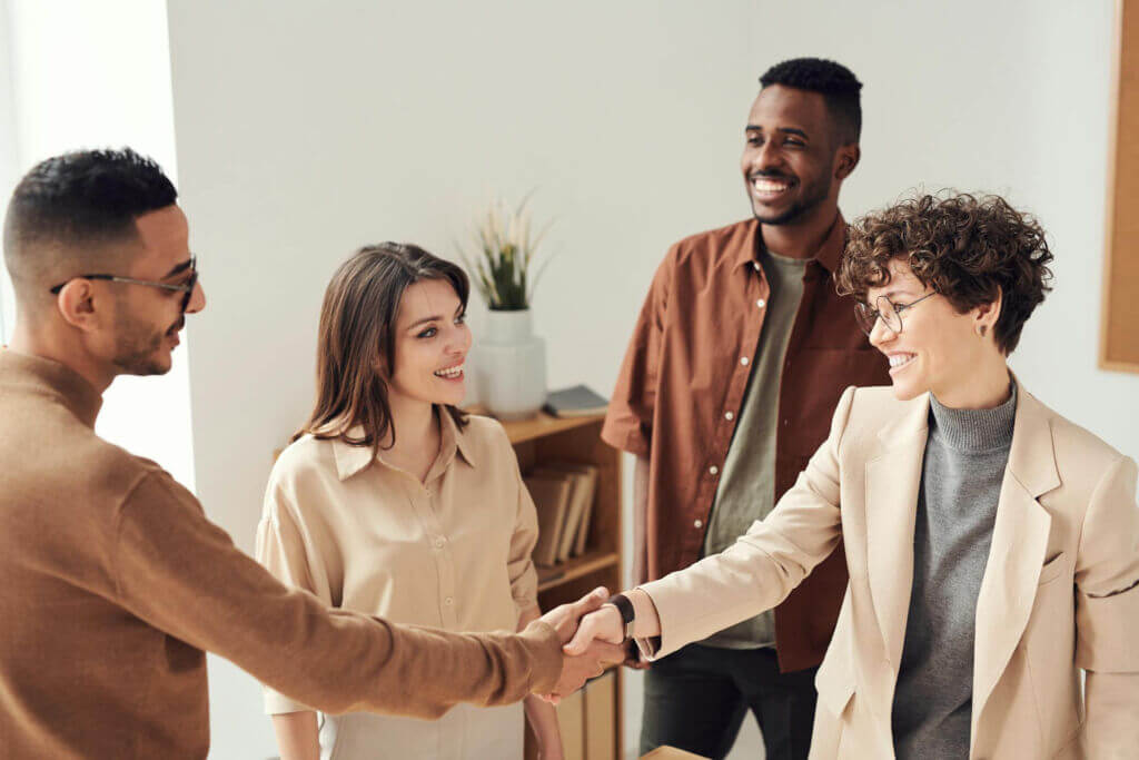 4 smiling people