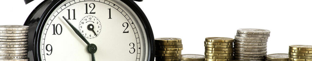 clock surrounded by coins