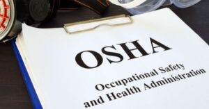 OSHA written on paper on clipboard