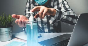 using hand sanitizer