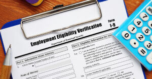 Form I-9 on clipboard, employment eligibility verification