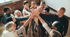 group high-fiving each other