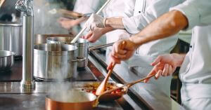 Line Cooks in Restaurant Kitchen