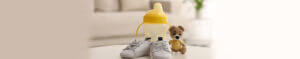baby booties bottle and bear