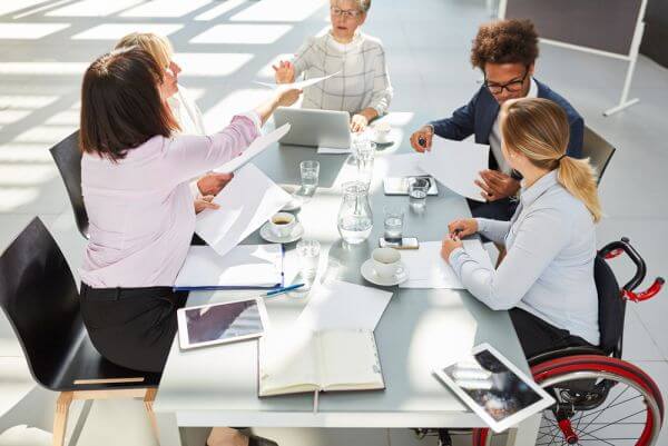 Team-Meeting-at-table-Diversity-Disability-Accessibility_web_med Team-Meeting-at-table-Diversity-Disability-Accessibility_web_med
