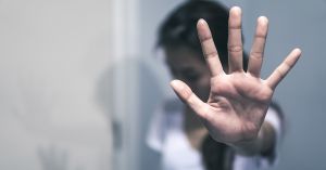 person holding out hand to avoid attention