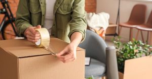 Woman Moving Packing Boxes