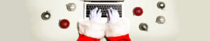 Santa Clause sitting at laptop typing