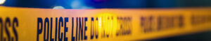Police tape over blurry background