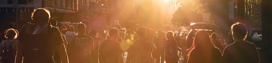 protesters walking at sunset