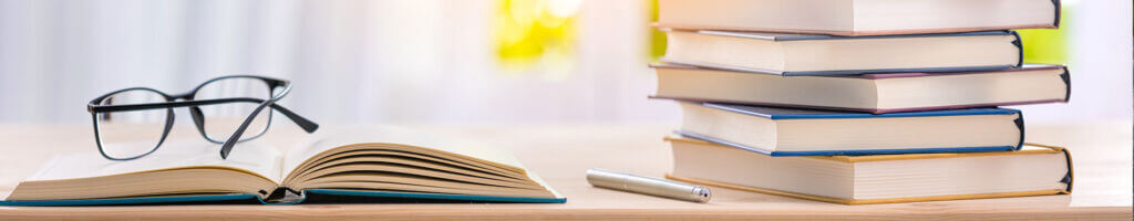 glasses sitting on open book