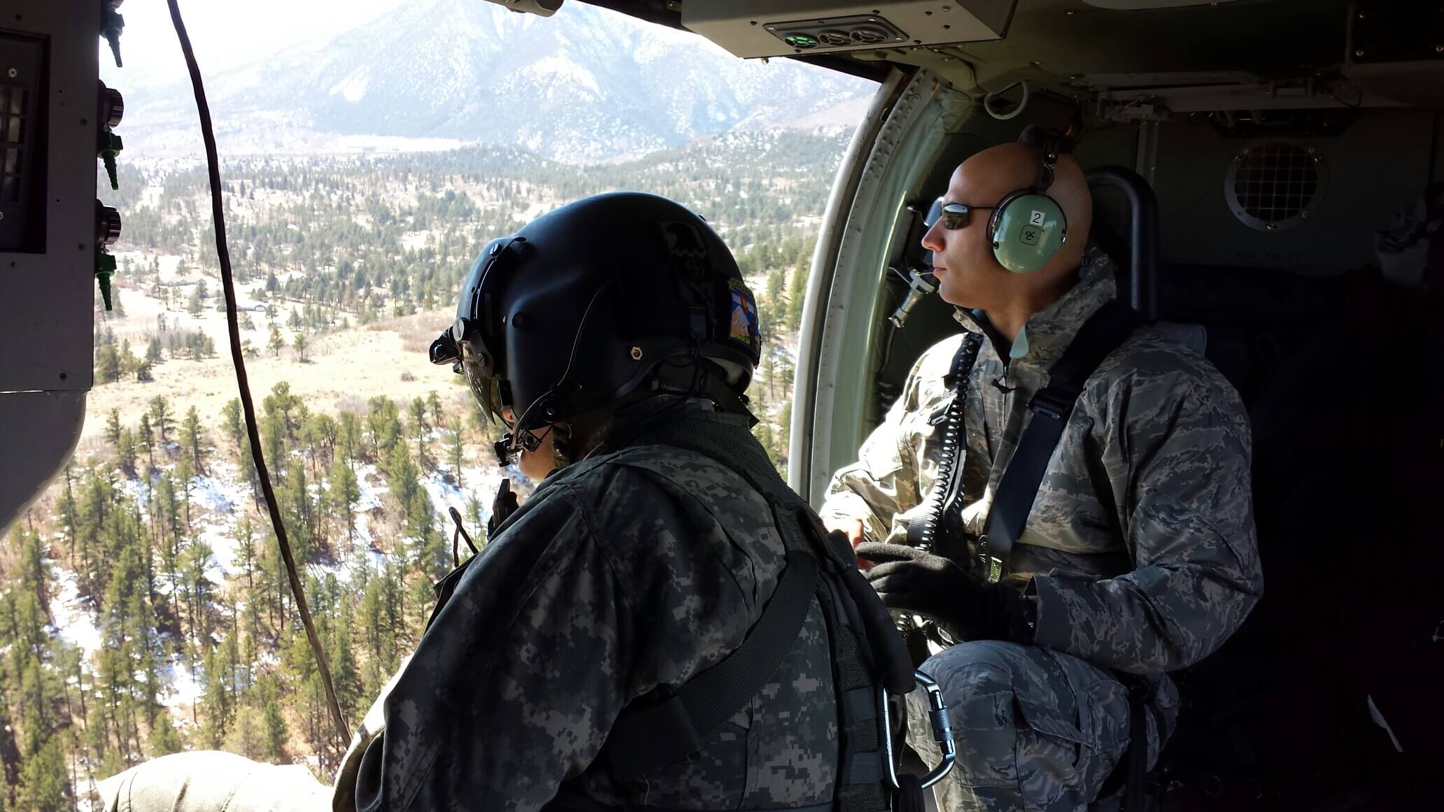 Robert Devall in uniform in a Black Hawk
