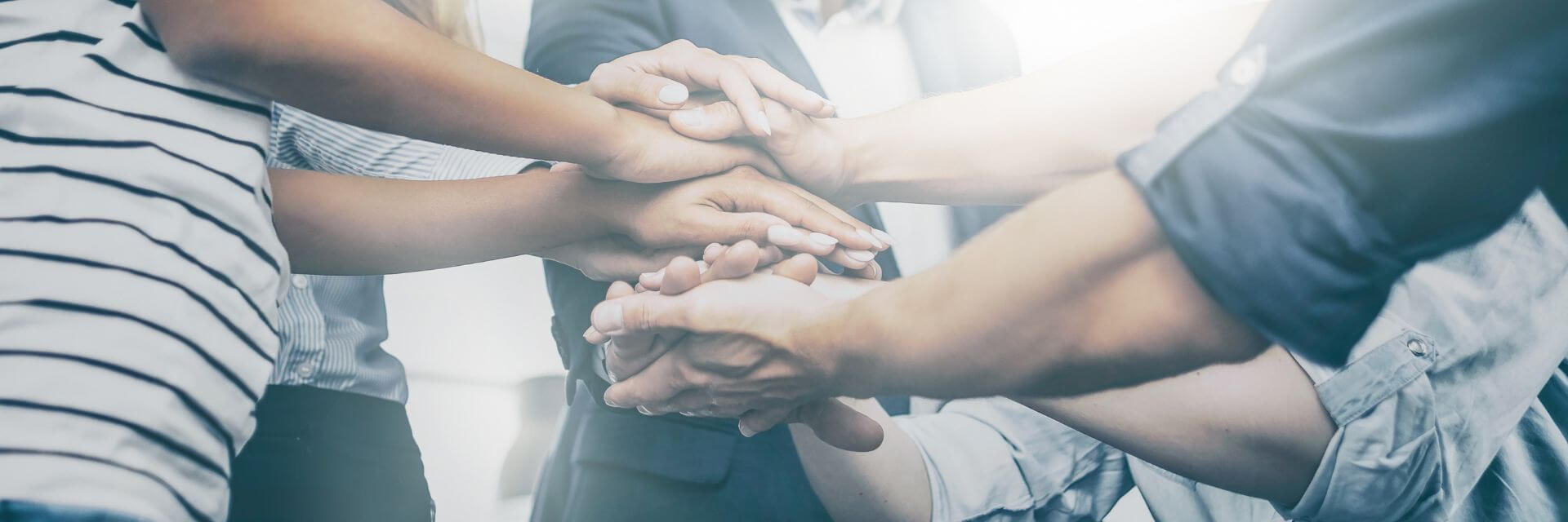 Team stacking hands together