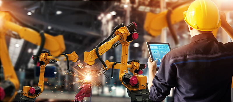 Engineer check and control welding robotics automatic arms machi Engineer check and control welding robotics automatic arms machine in intelligent factory automotive industrial with monitoring system software. Digital manufacturing operation. Industry 4.0
