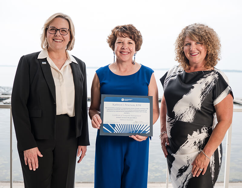 Midwest Institute 2025 Kathy Peterson, Membership Director with the Greater Wausau Chamber of Commerce, graduated from the Institute of Organization Management in Madison on June 4, 2025. She is pictured, center, with Angie Whitcomb, IOM, President and CEO of Hospitality Minnesota, left, and Institute Board of Regents Chair Jennifer Reiser, CCE, IOM, right.