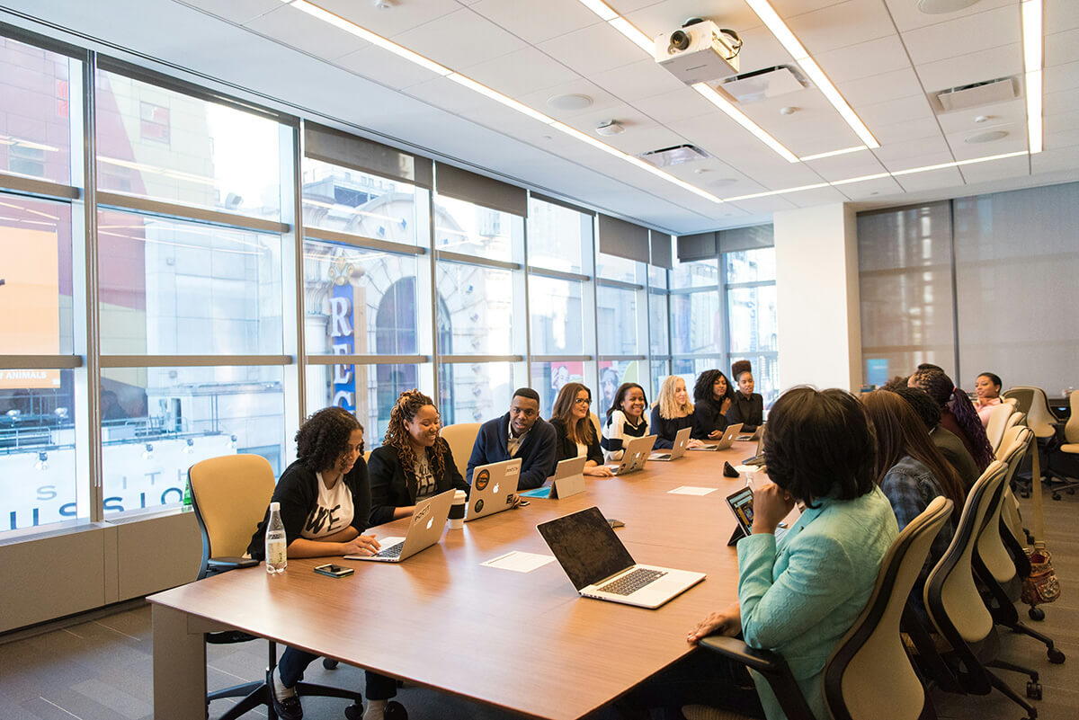 nsplsh_586a4b3fa61c452c910d6d471d1733e2~mv2 people seated around table for meeting