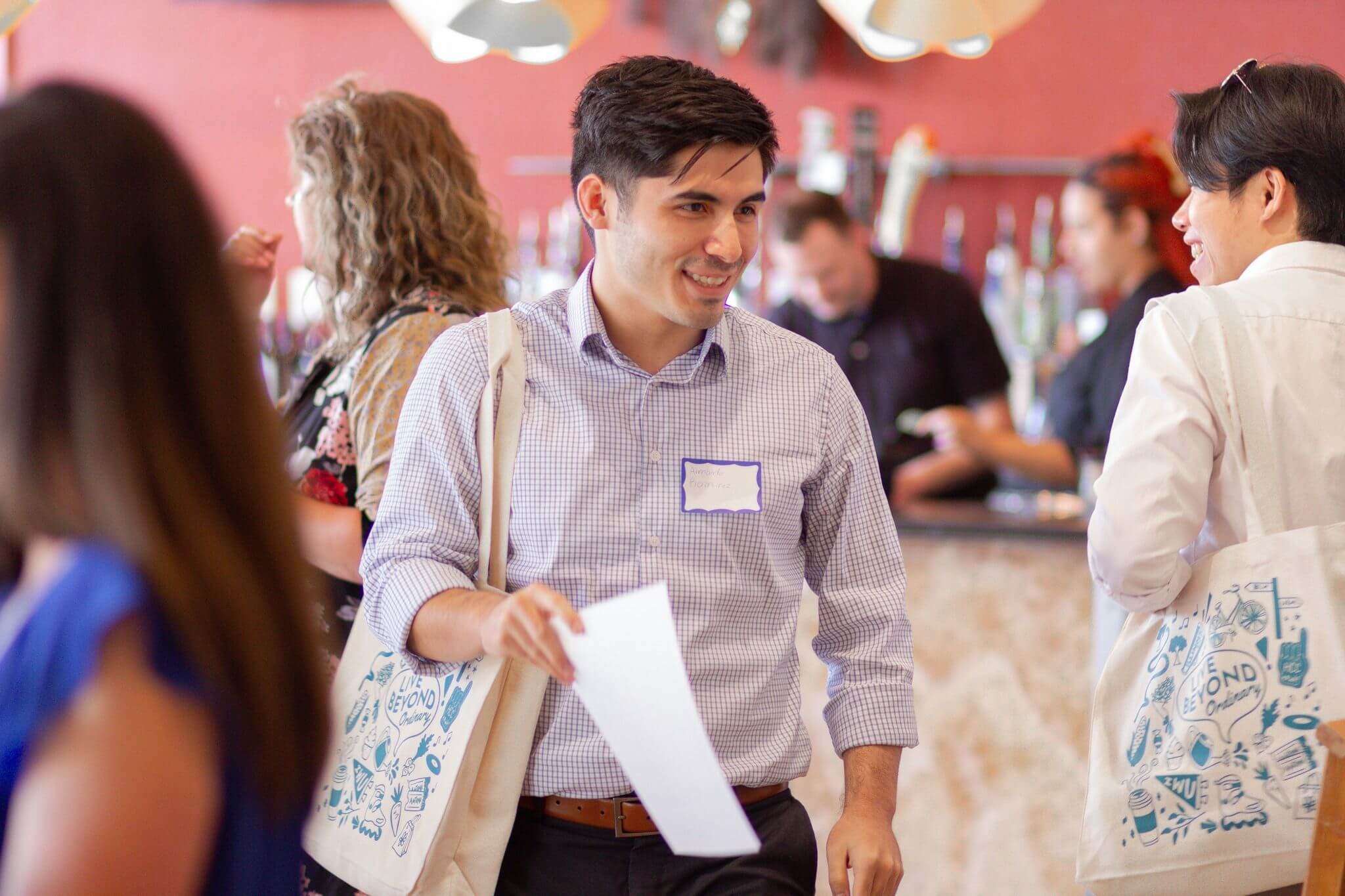 447963200_882672810554258_2657200055720390895_n man with bag at event