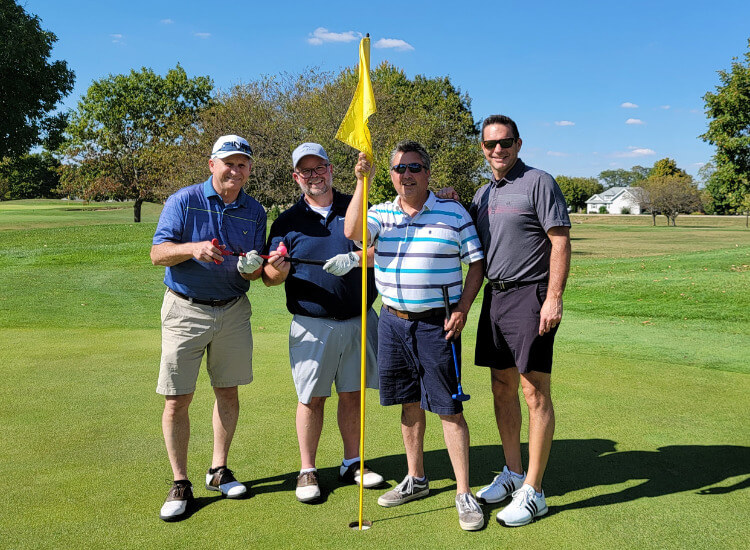 Happy golfers at golf outing.