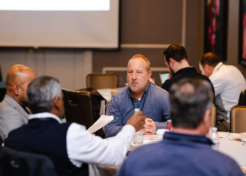 people sitting at table talking