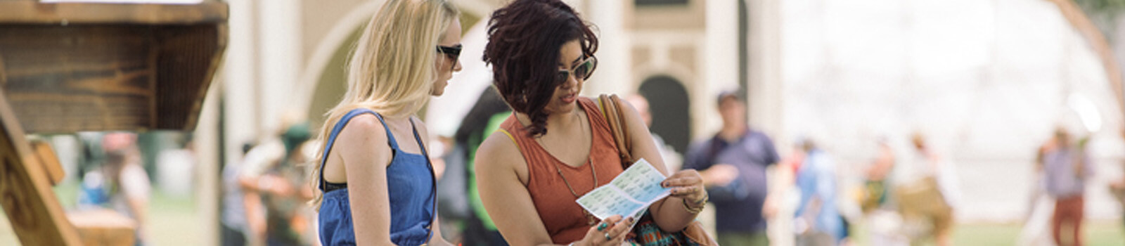 Live Two women look at a shopping map in Pasadena