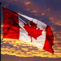 Image of a Canadian flag in the sunset