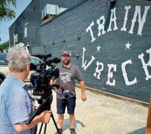 man talking in front of camera