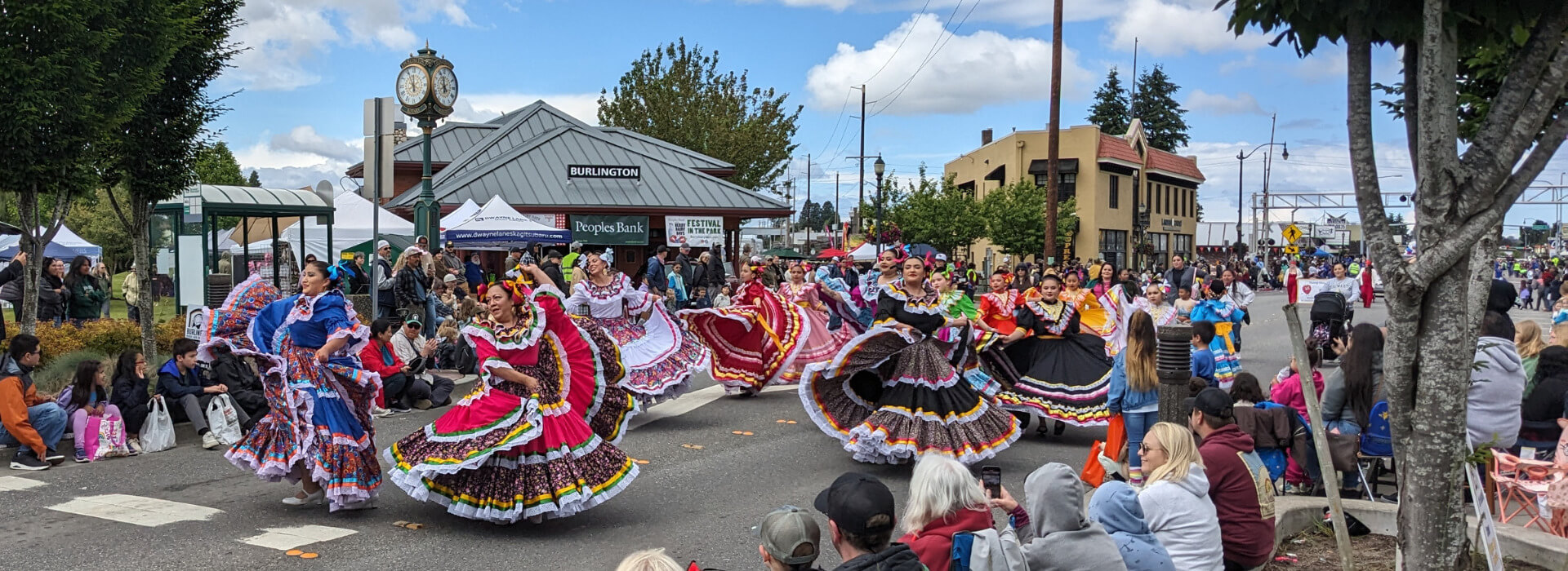 Folklórico dancers performing during the Berry Dairy Days Grand Parade in front of the Burlington Visitor Information Center in Burlington Washington