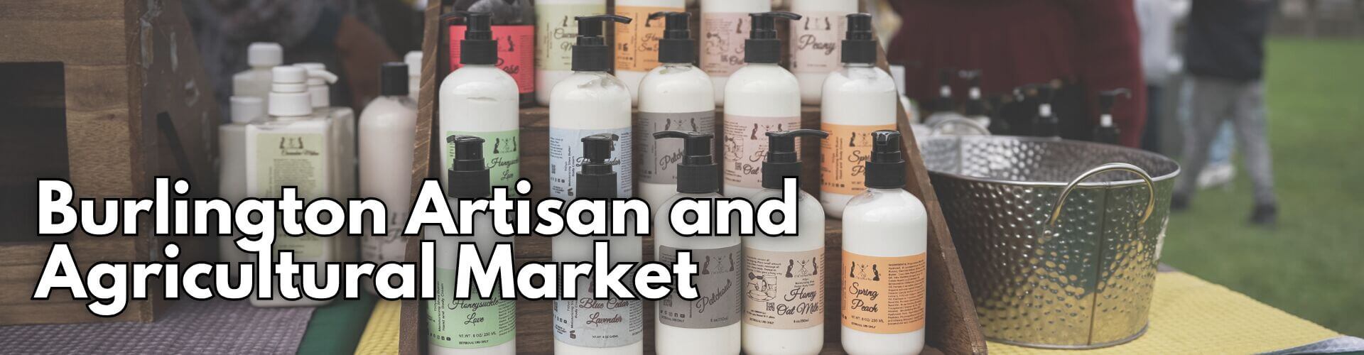 Vendor booth featuring handmade lotions and artisan products at the Burlington Artisan and Agricultural Market in Historic Downtown Burlington, Washington.