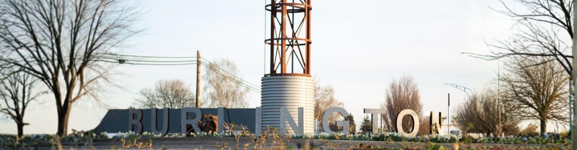 Entrance to Burlington, Washington featuring the iconic Burlington sign and grain silo as visitors enter town from the north, showcasing the welcoming gateway to Skagit Valley.