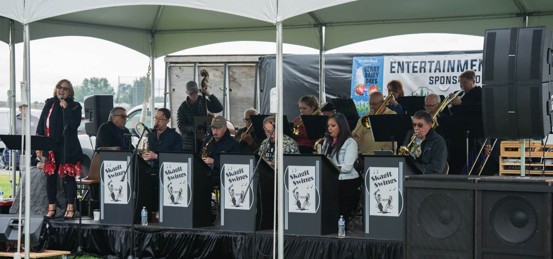 Crowds enjoying live music and performances at the Berry Dairy Days Entertainment Stage in Burlington WA