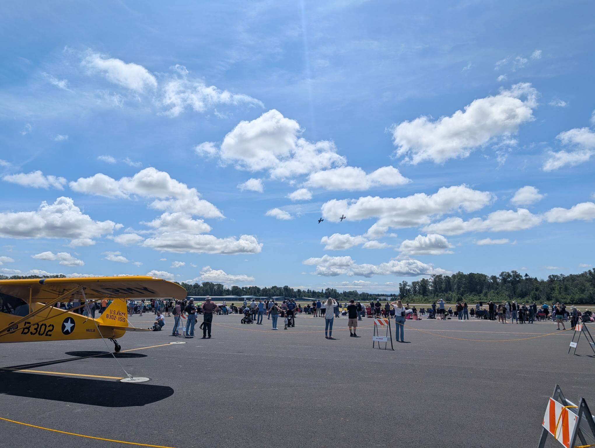 Aircraft and visitors during the Skagit Skies Airshow at Skagit Regional Airport in Burlington Washington
