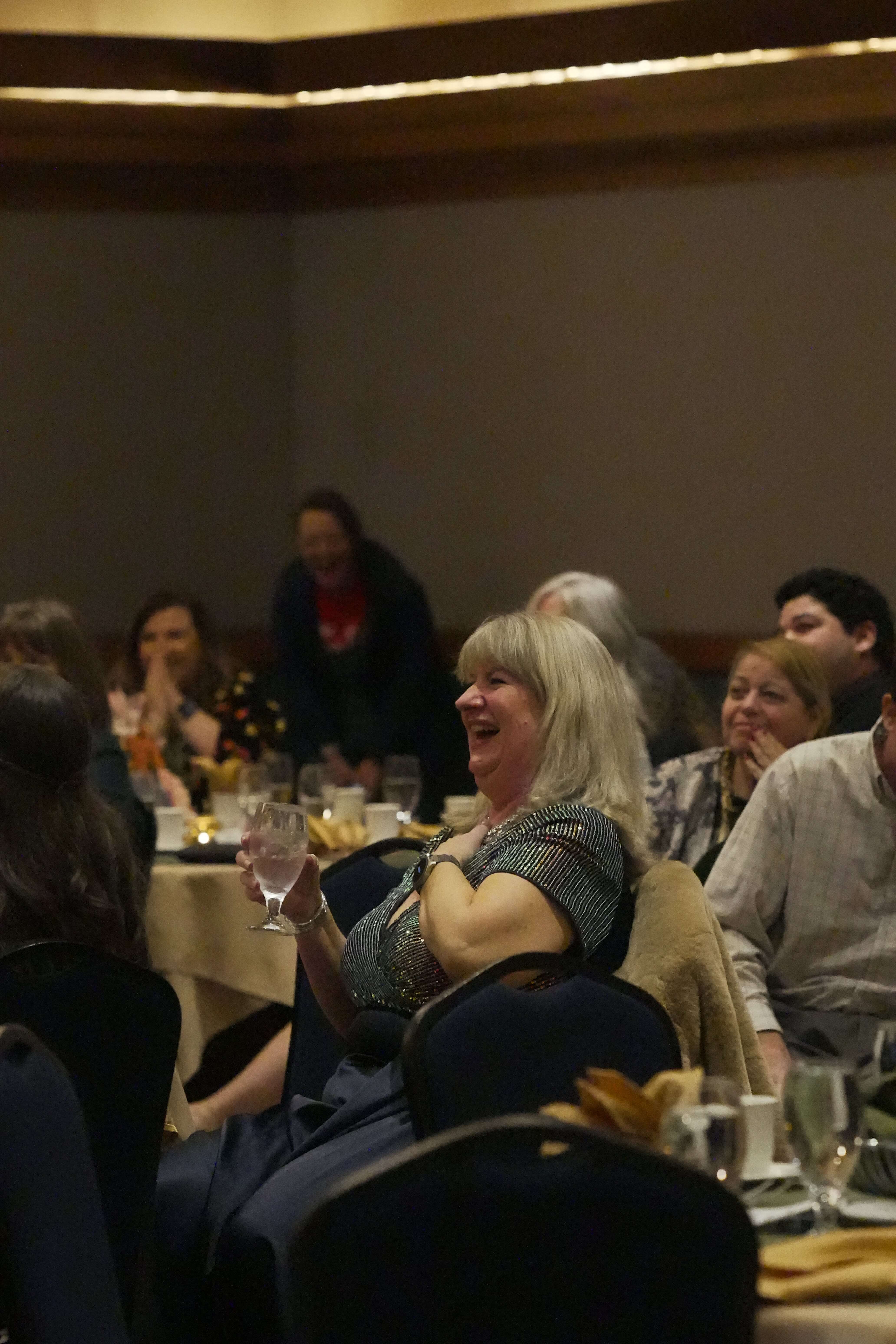 A guest laughs during dinner and presentations at the 2025 Burlington Chamber Awards of Excellence.