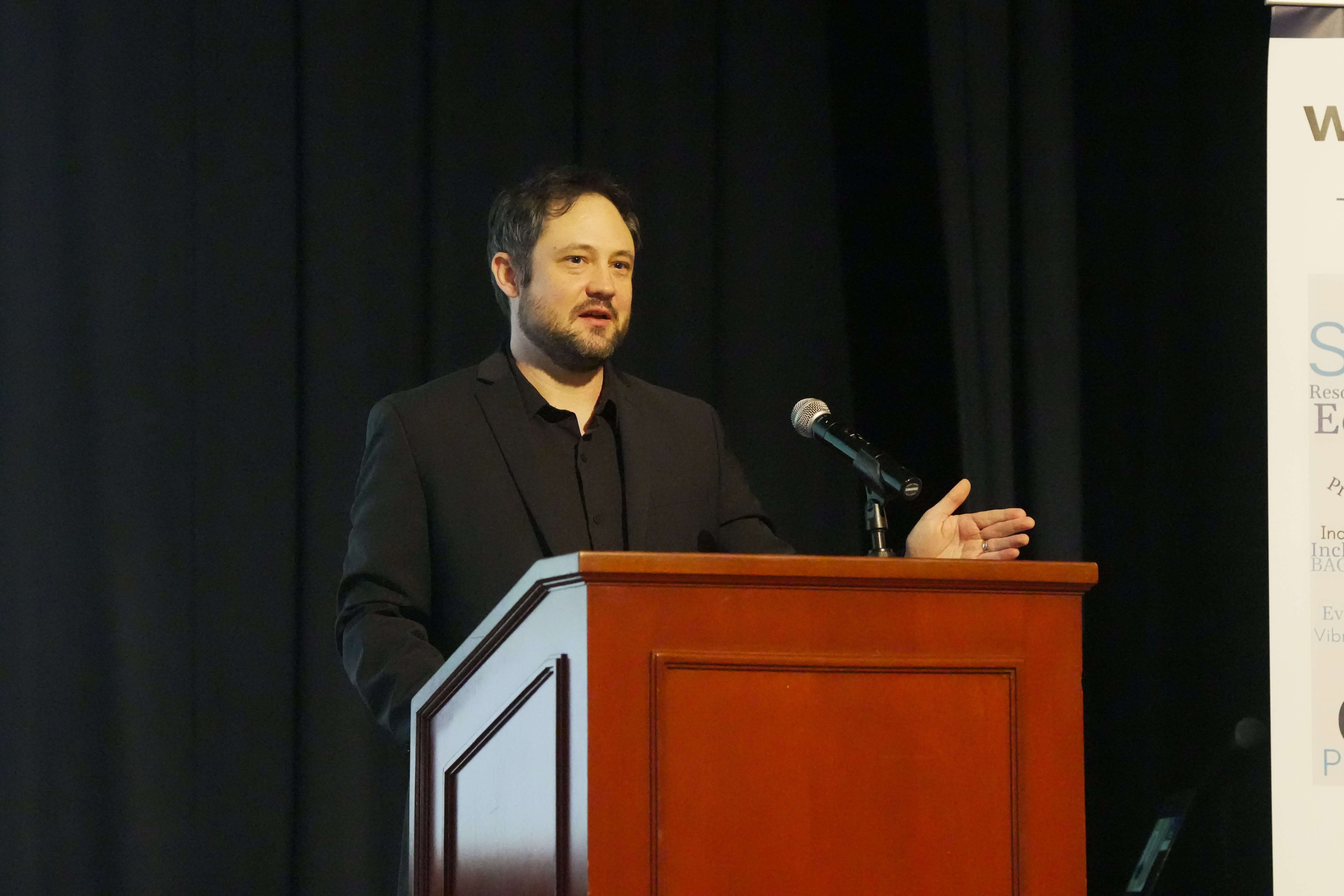 Aaron Weinberg delivers a workforce development update at the 2025 Burlington Chamber Awards of Excellence.