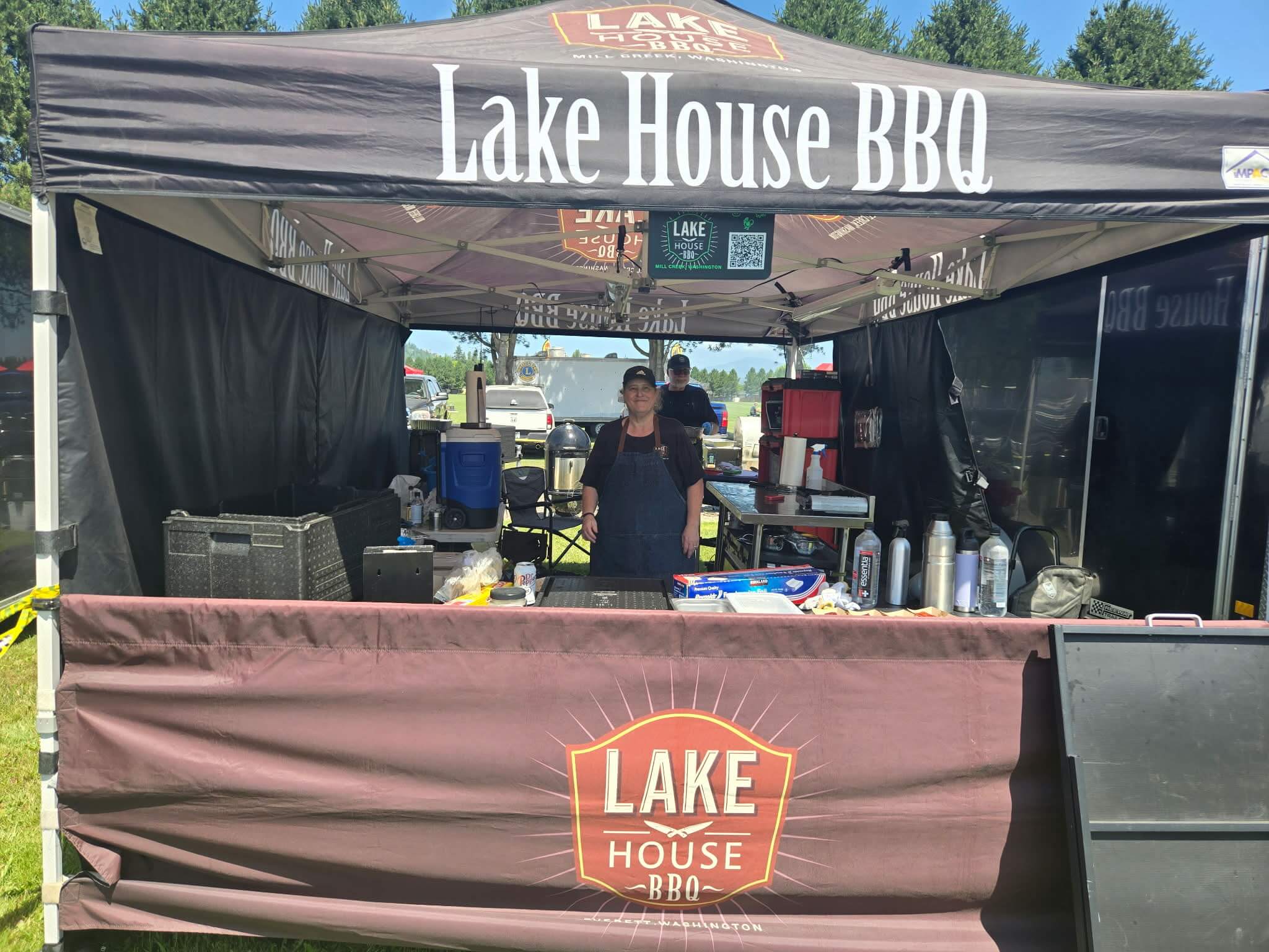 Lake House BBQ team booth during the Smoke & Grill BBQ Competition at Berry Dairy Days in Burlington, Washington.