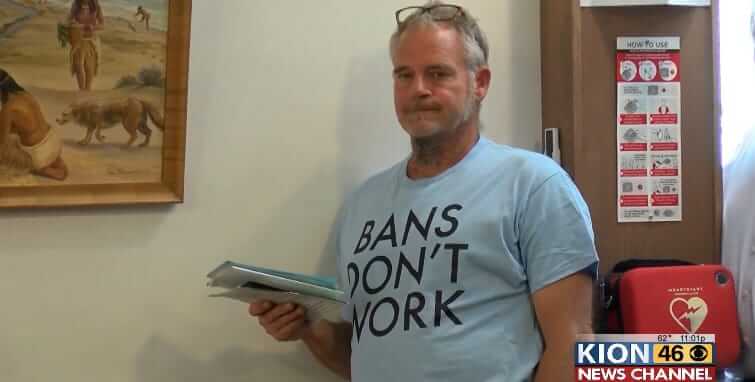man holding papers