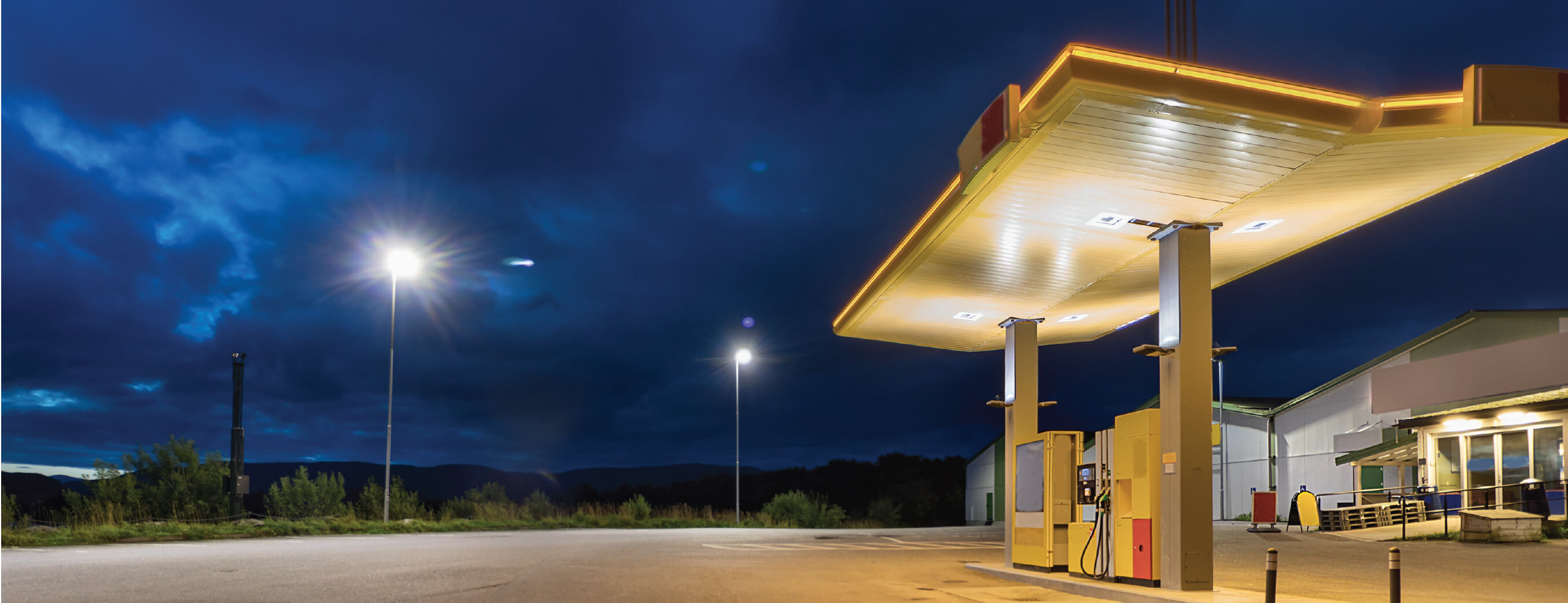 a small gas station at night
