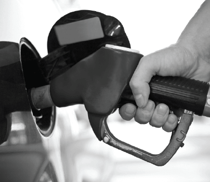 a hand pumping gas into a car