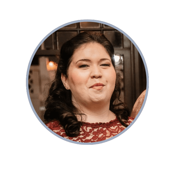 Woman smiling in a burgundy shirt