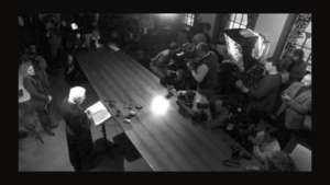 Black and white photo of press conference.